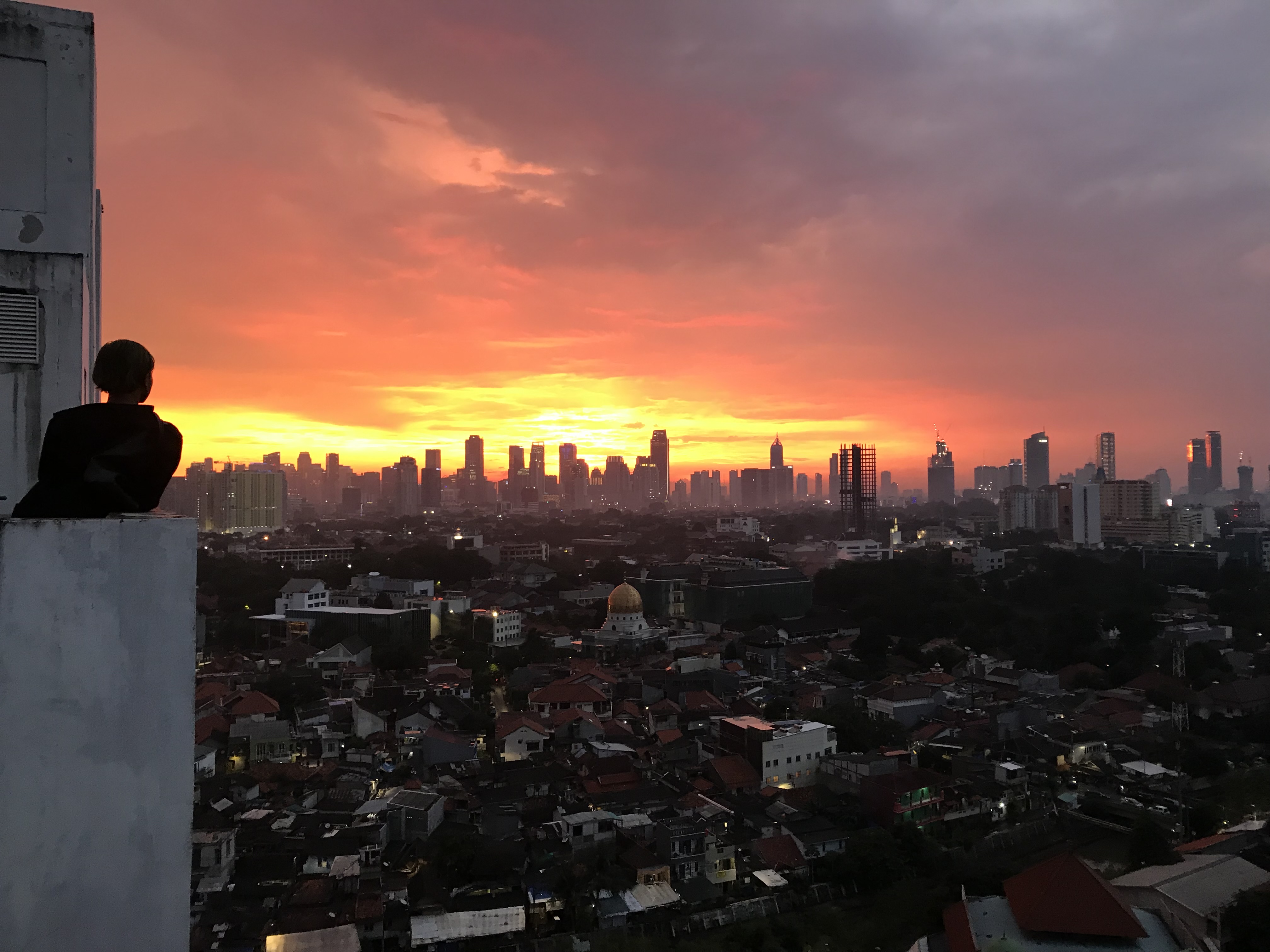 Rio, a young Indonesian, stares at the sunset in Jakarta, where the LGBT people face stigmatisation and discrimination.